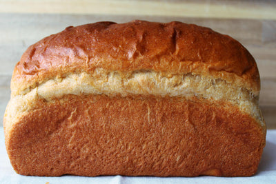 a side view of a butter honey wheat sandwich loaf copyrighted image