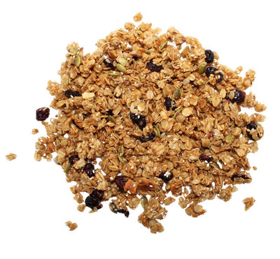 a portion of clean cranberry granola with sunflower, sesame, pumpkin and flax seeds on a white background