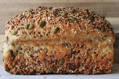 side view of golden harvest wheat sandwich loaf with seeds copyrighted image